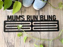 Load image into Gallery viewer, For the running mum. Elegant medal hangers to display all the hard earned bling from the fun runs, the trail run series, the ultras, the half marathons, the City to Surf's...I could go on. Powdercoated classic Matt Black. comes in 6 or 8 bar versions