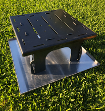 Load image into Gallery viewer, Step 2 of the fire pit assembly - add the fire pit base plate onto the legs