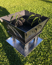 Load image into Gallery viewer, Design #1 = Gum nut & Leaf. inspired by our beautiful Western Australian Flora. Sides have slots for your BBQ skewers or marshmallow sticks (spot the error in this photo - whoops). the side assembly slots are all the same, and you can orientate them in which ever configuration you choose ...although we do suggest placing the skewer slots opposite each other !! #photo fail