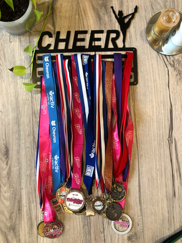 Matt Black powdercoated medal display holder. 4 bars, with CHEER text at the top and a figure in heel stretch pose.