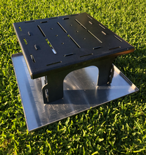 Load image into Gallery viewer, Step 2 of the fire pit assembly - add the fire pit base plate onto the legs

