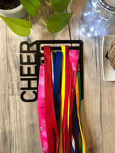 Load image into Gallery viewer, Matt Black Medal Display holder in Matt Black. CHEER Text runs vertically up the side of the medals. 8 rows to allow display at different heights
